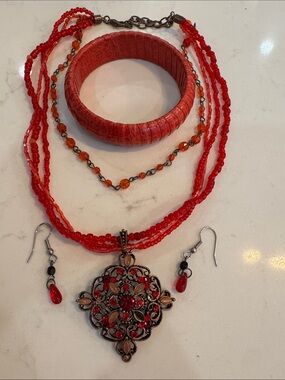 Bundle with 4 pieces. Beaded necklace with statement brooch and faux stones